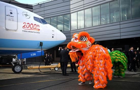 Photo taken on Nov. 30, 2018 shows the delivering ceremony of the 2,000th Boeing airplane to China in Seattle, the United States. Top U.S. aircraft manufacturer Boeing Company on Friday delivered its 2,000th airplane to China, which is a milestone for the U.S. aircraft maker in the world's largest commercial aviation market. (Xinhua/Wu Xiaoling)